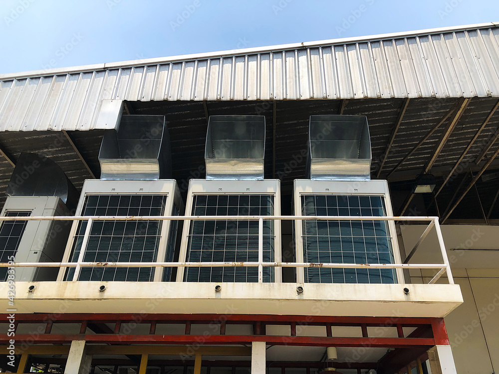 Large air conditioner compressors located outside a passenger terminal