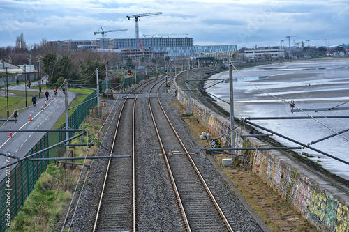 Photography Beautiful evening contrast aerial-like north-oriented view of Irish railway alon