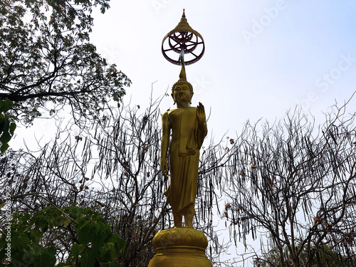 The statue of golden Buddha at a Thai temple