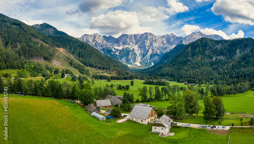 Aerial view of Alpine valley with farmhouse in Jezersko  Slovenia