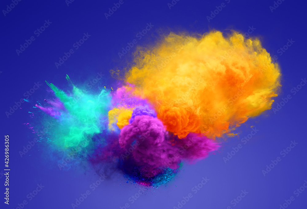 Yellow, agua and violet powder explosion on blue background