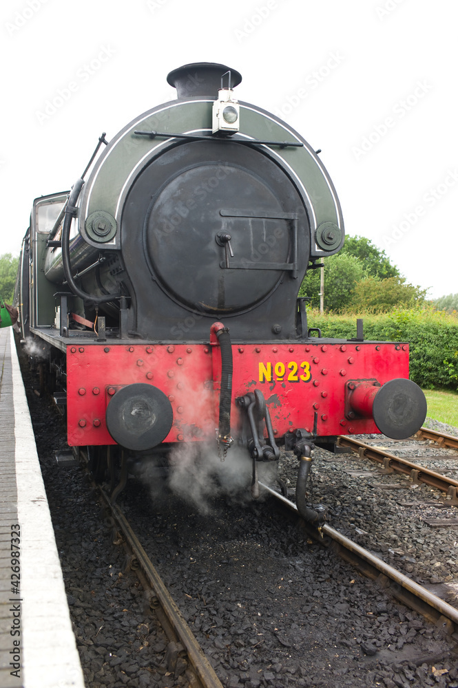 Fototapeta premium Front view of a USA 0-6-0T class steam locomotive on the Kent and East Sussex Railway in Tenterden, Kent