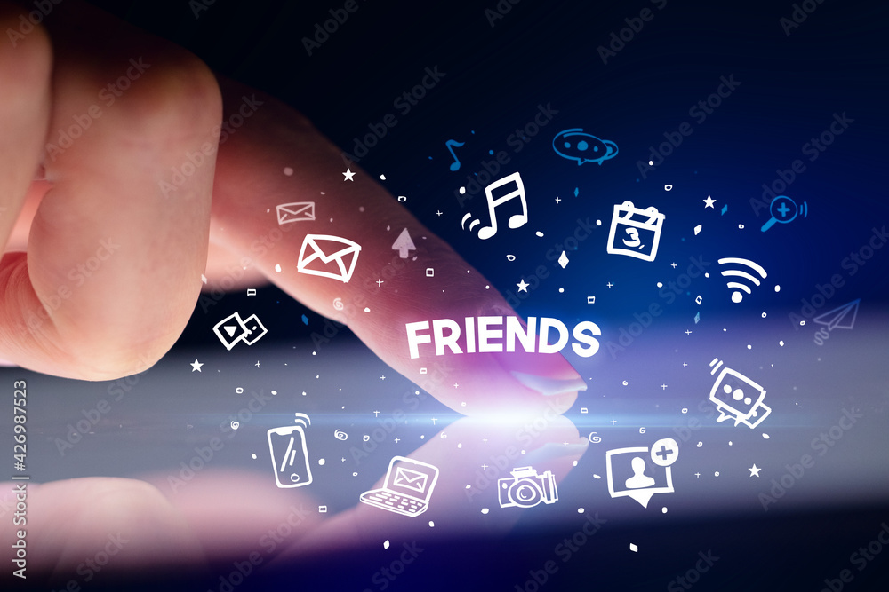 Finger touching tablet with social media icons concept
