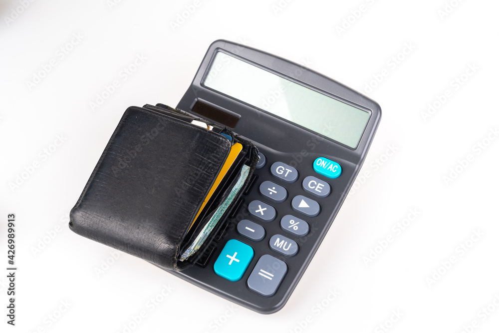 Digital calculator and money with white background.