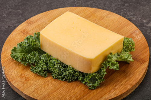 Tasty yelloow Tilsiter cheese brick