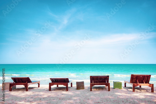 Summer background, Sunbath lounge chair on the beach with beautiful sea in daytime © Danai