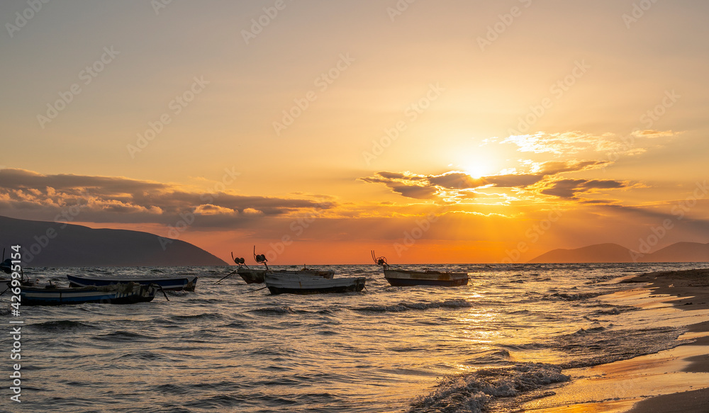 Beautiful fishing boats at sunset at the adriatic sea.