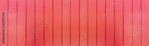 Panorama of New red vintage wooden wall texture and background seamless or a green wooden fence