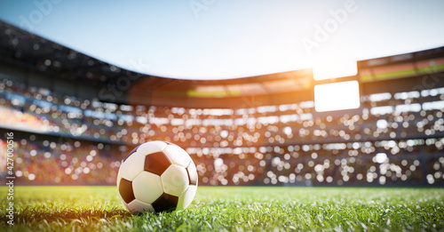 Football soccer ball on grass field on stadium #427000516