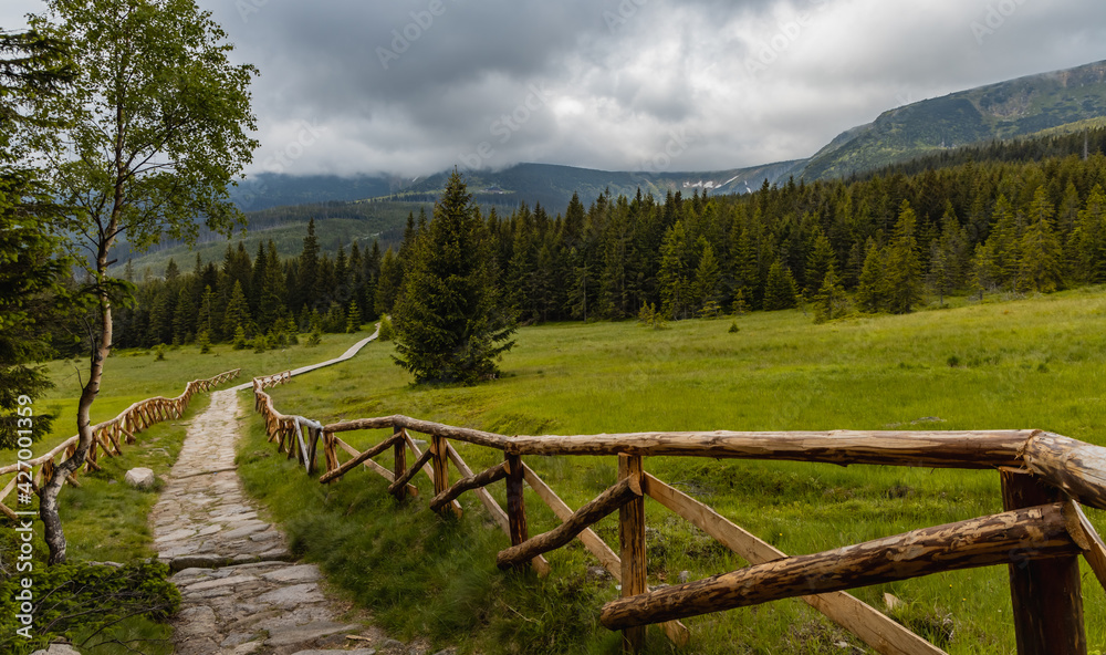 Long mountain trail with panorama of Karkonosze Giant Mountains around