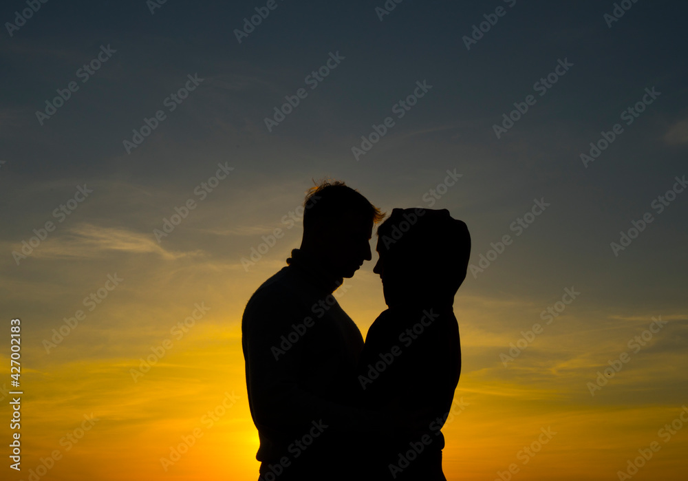 Romantic lovers. Romance lovers. Sunset. Shadow. People. Love.
