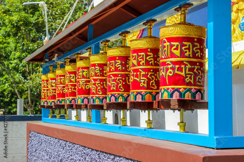 Prayer Wheels of Buddhists, followers of Lord Buddha visiting monasteries spin the colorful prayer wheels  as a part of  a religious ritual in Buddhism.