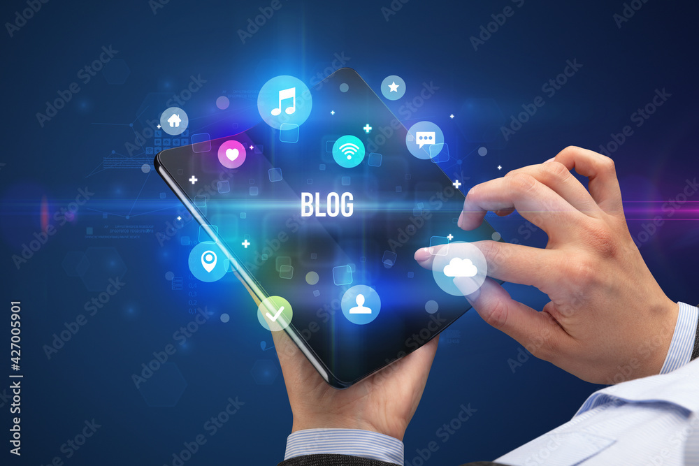 Businessman holding a foldable smartphone
