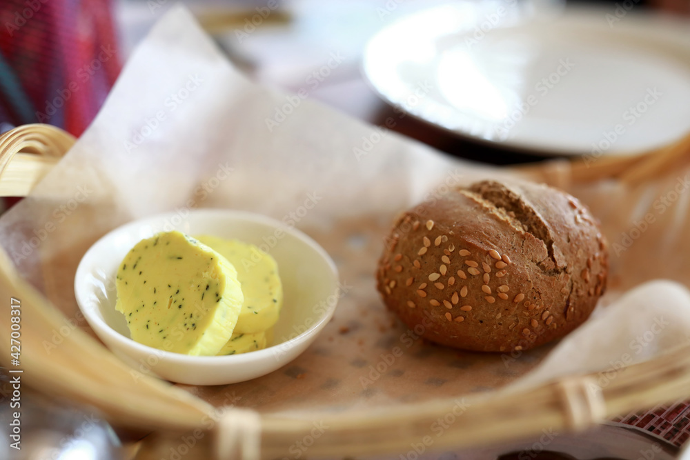 Bun and butter in basket Bun and butter in basket