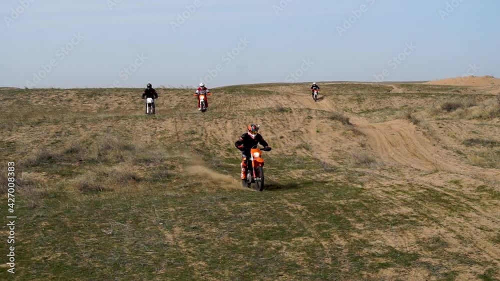 person riding a bike. motorcycle ride through the sandy mountains. motorcycle on the beach person riding a bike. motorcycle ride through the sandy mountains. motorcycle on the beach