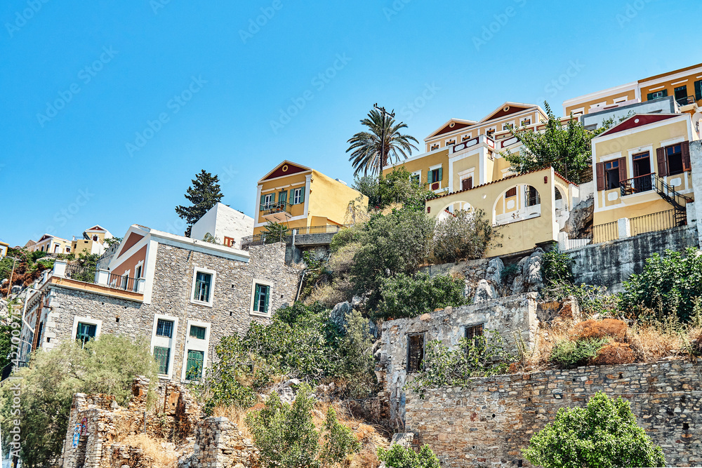 Multicolored historical buildings in old town on Symi island