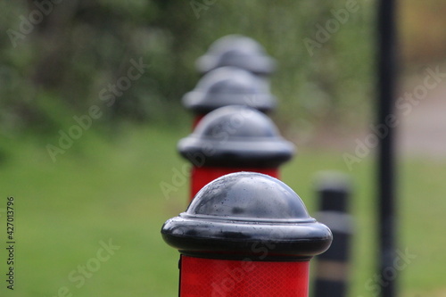 red and black bollards