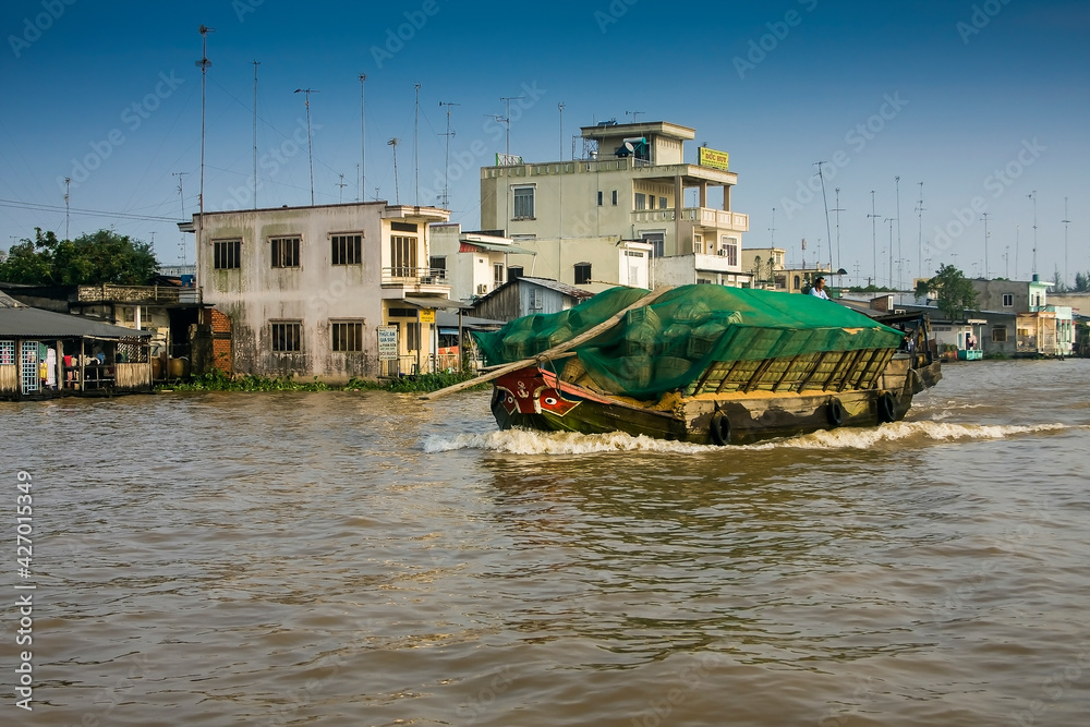 Transport ship on the Mekong River in Cai Be, Mekong Delta, Vietnam, Southeast Asia