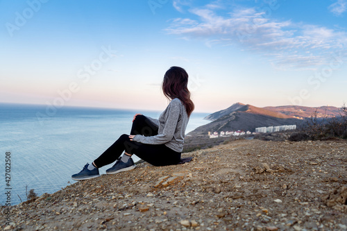 woman sittimg back and looking on view