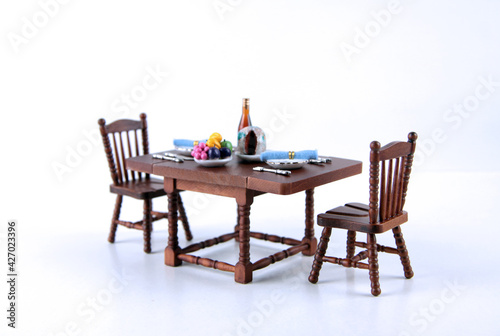 dollhouse interior - served dining table isolated on white background close up