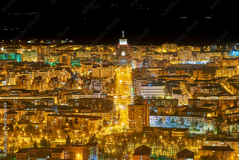 Night city lights. You can see a main boulevard in the city. You can see the lights of the blocks. Baia Mare, Maramures. 