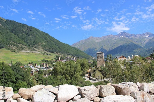 mountain village in Georgia. Svaneti. Svan tower against the background of a mountain landscape on a clear summer day.