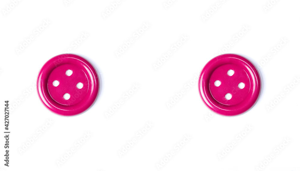 Pink buttons on a white background closeup. Beautiful bright buttons