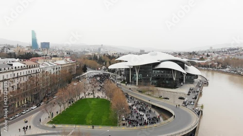 Tbilisi, Georgia - 9th april, 2021: People walking in streets in Georgia capital. Aerial view Tbilisi tragedy anniversary demonstration. photo