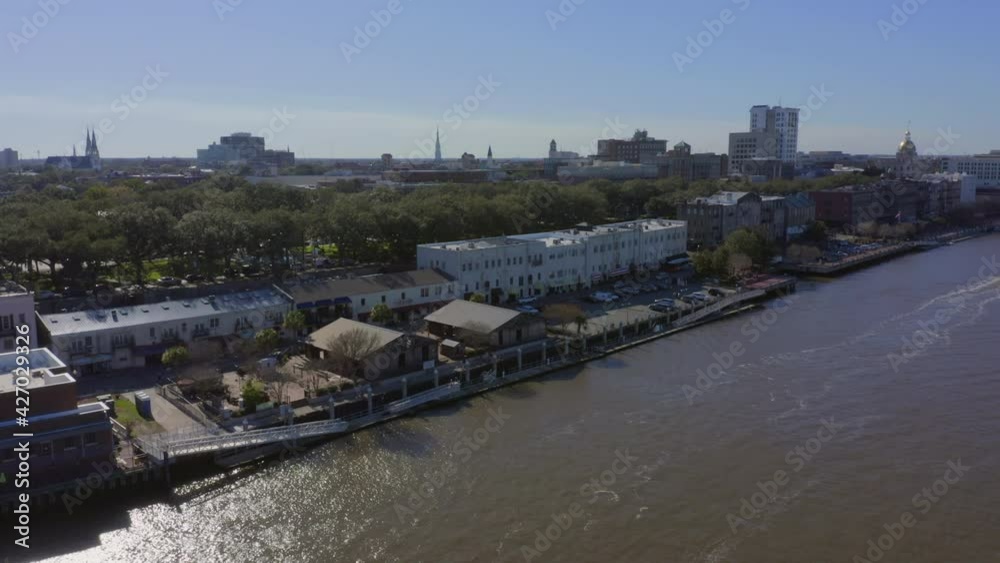 Aerial view pulling away of Savannah River and its River Street Boardwalk Aerial view pulling away of Savannah River and its River Street Boardwalk