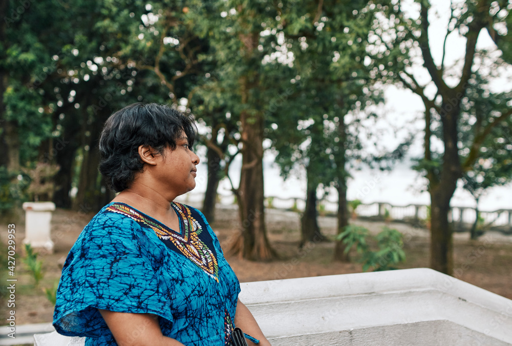 Portrait of a pensive looking middle aged Indian woman (Bengali