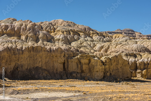 Eroded landscape and rock towers in Zanda soil forest photo