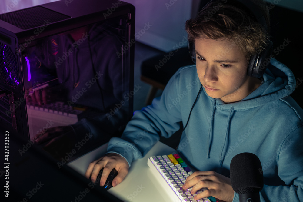 Video game streamers playing on their home console. Teenager playing