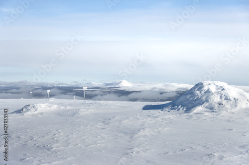 view of a mountain above the clouds during holiday in the sun