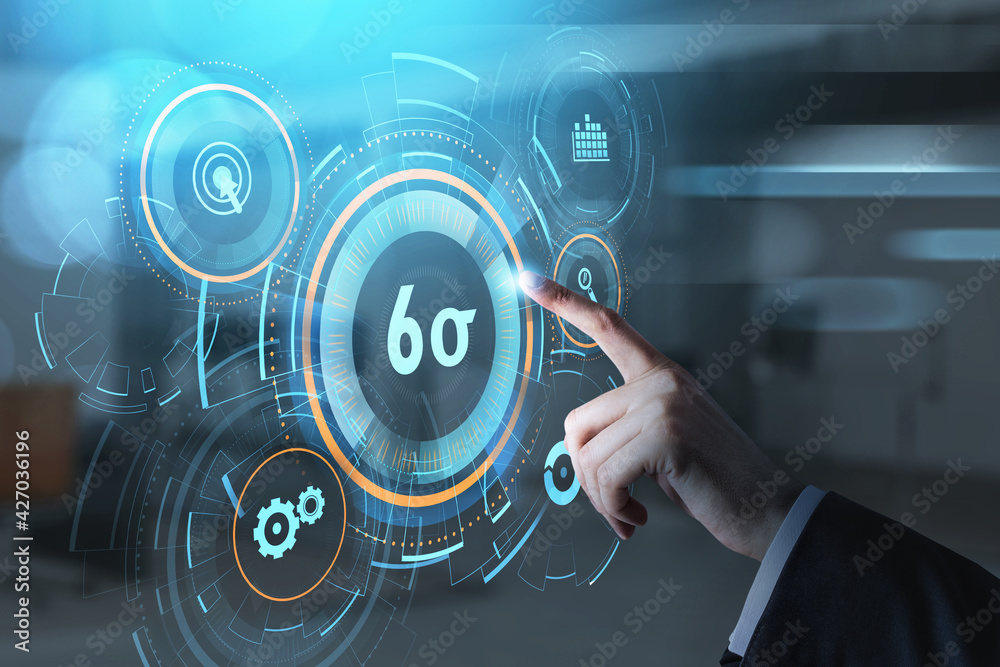 Businessman hand, finger pushing a virtual button on digital interface. Six sigma, quality control and manufacturing process management concept on screen. Businessman hand, finger pushing a virtual button on digital interface. Six sigma, quality control and manufacturing process management concept on screen.