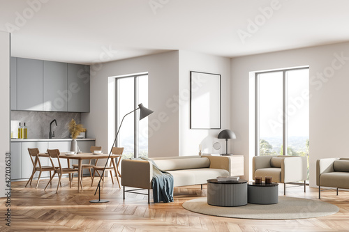 Bright modern kitchen room interior with cupboard and dinner table photo