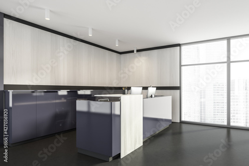 Grey and white wooden reception room interior with computers on marble floor