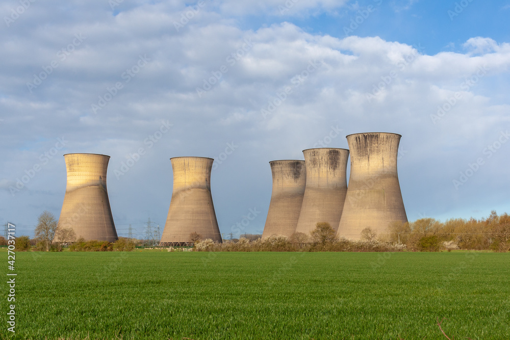 Willington, Derby, UK, April,11,2021:The large cooling towers of the now disused Willington Power Station. These tall iconic structures now standing derelict. Willington, Derby, UK, April,11,2021:The large cooling towers of the now disused Willington Power Station. These tall iconic structures now standing derelict.