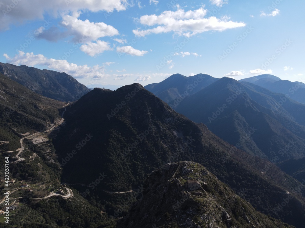 Fototapeta premium Aerial view Of historical kougi mountains and agia paraskevi church of souli In epirus, greece