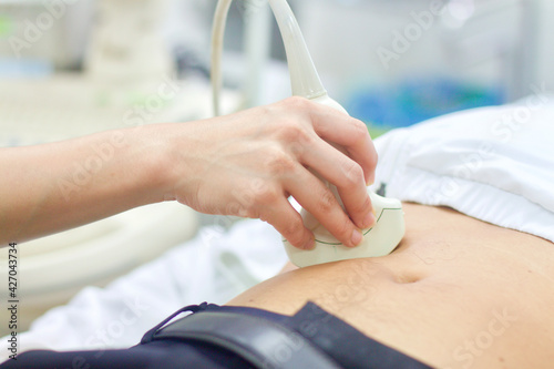 Wallpaper Mural doctor examining patient by ultrasound. Torontodigital.ca