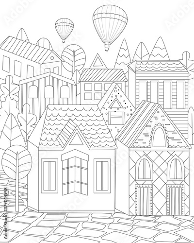 cute town with cobblestone street and hot air balloons in the sk