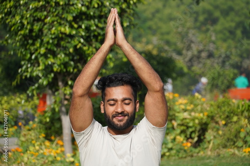 a man doing saurayanamaskaar yoga