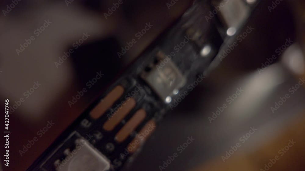 Closeup look at LED strip, cheap modern technology widely used in illumination of all kinds Closeup look at LED strip, cheap modern technology widely used in illumination of all kinds