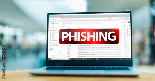 Laptop displaying the sign of phishing on the internet photo