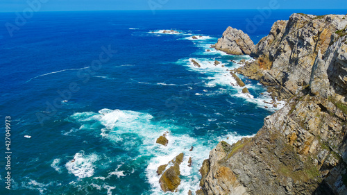 La Gavierona, in the northern part of Spain. With the view of El Pegollo, El Parado and Los Merendlvarez. The northern Spanish coastline is rugged and beautiful, with constant punishment of the waves.