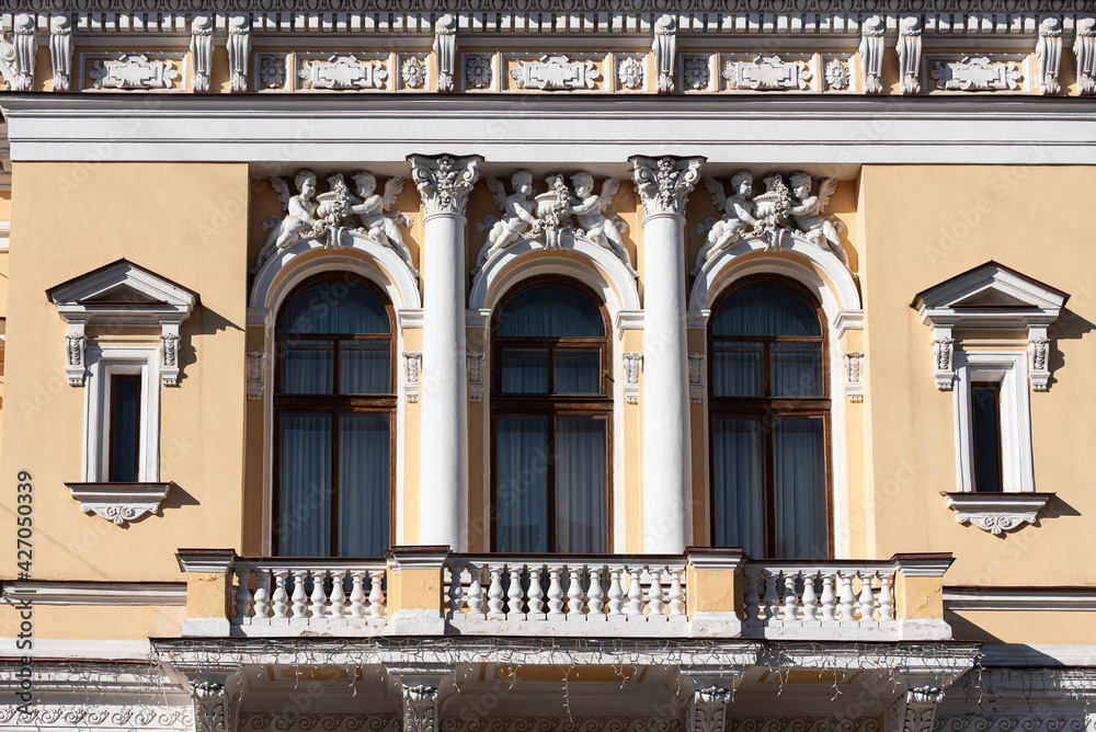 Fototapeta premium Windows on old city facades, with decorative elements