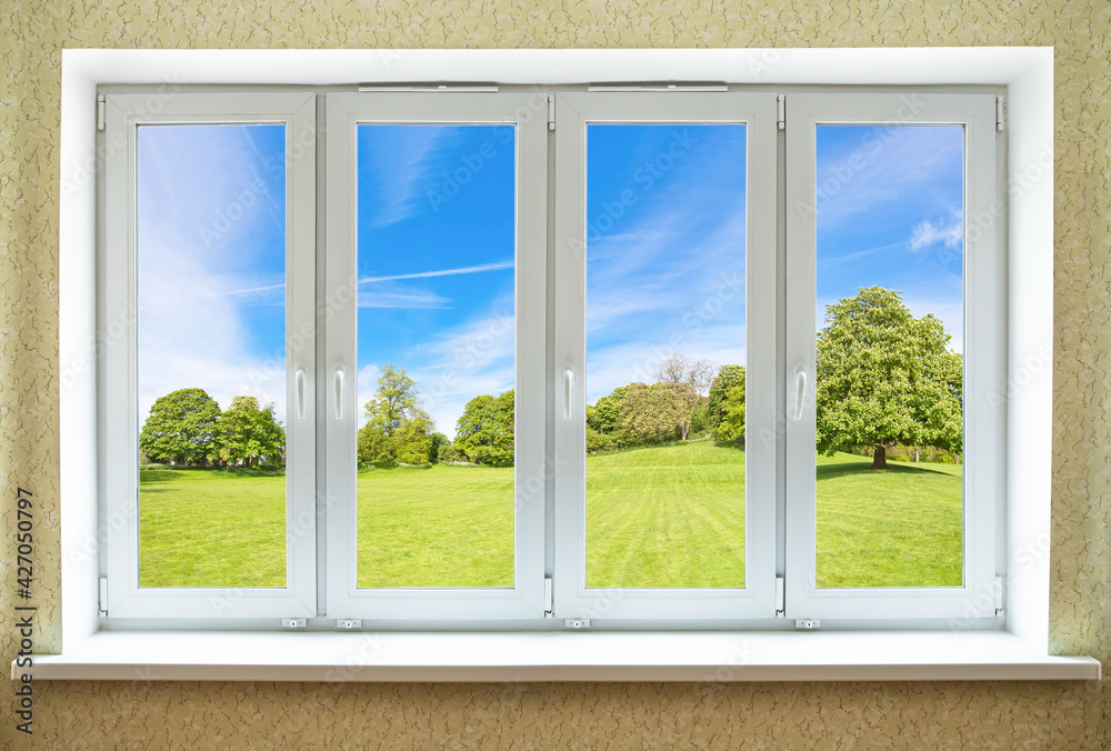 View through a modern PVC window onto beautiful spring landscape
