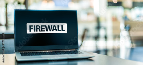 Laptop computer displaying a sign of the firewall