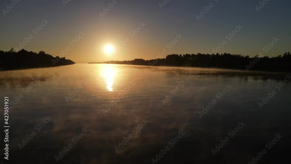 Aerial shot foggy Amazon river in South America at sunset