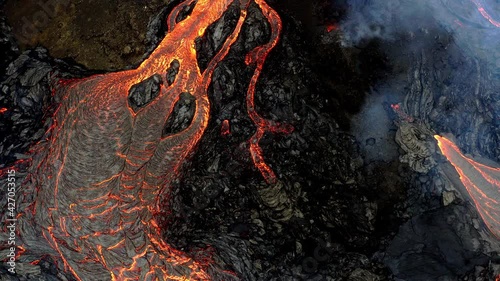 A volcano in the Reykjanes peninsula in Iceland. The eruption site consists of several craters in an enclosed valley where the largest vent is roughly 100 meter high. photo