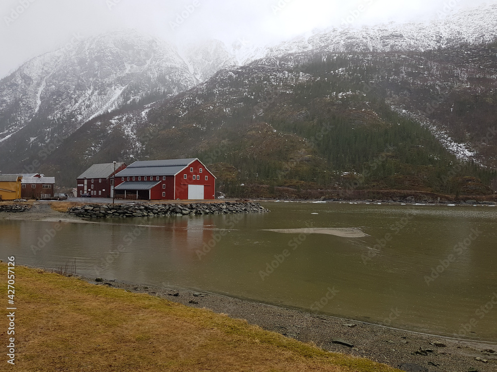 The beautiful city of Mosjøen in Northern Norway with the river Vefsn running through and old buildings